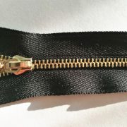 No.5 zipper with light gold teeth and  auto lock slider